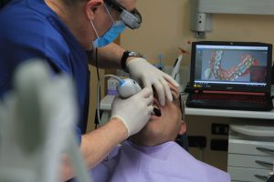 dentist examine patients teeth