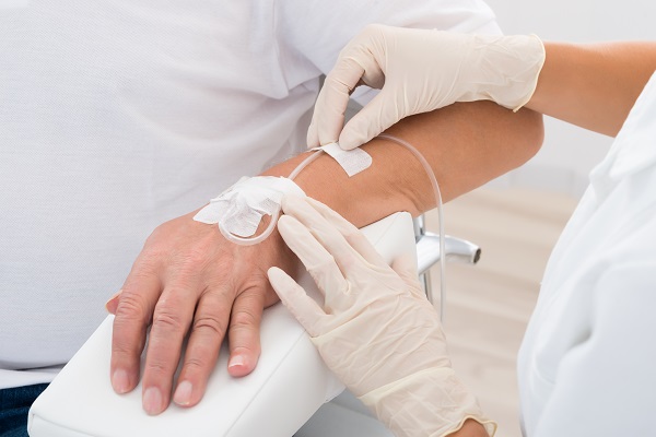 Iv Drip Inserted In Patient's Hand